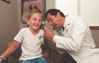 Center of Excellence Picture of Dr. with Child